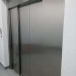 Stainless steel elevator sliding doors installed by Mechano Elevator